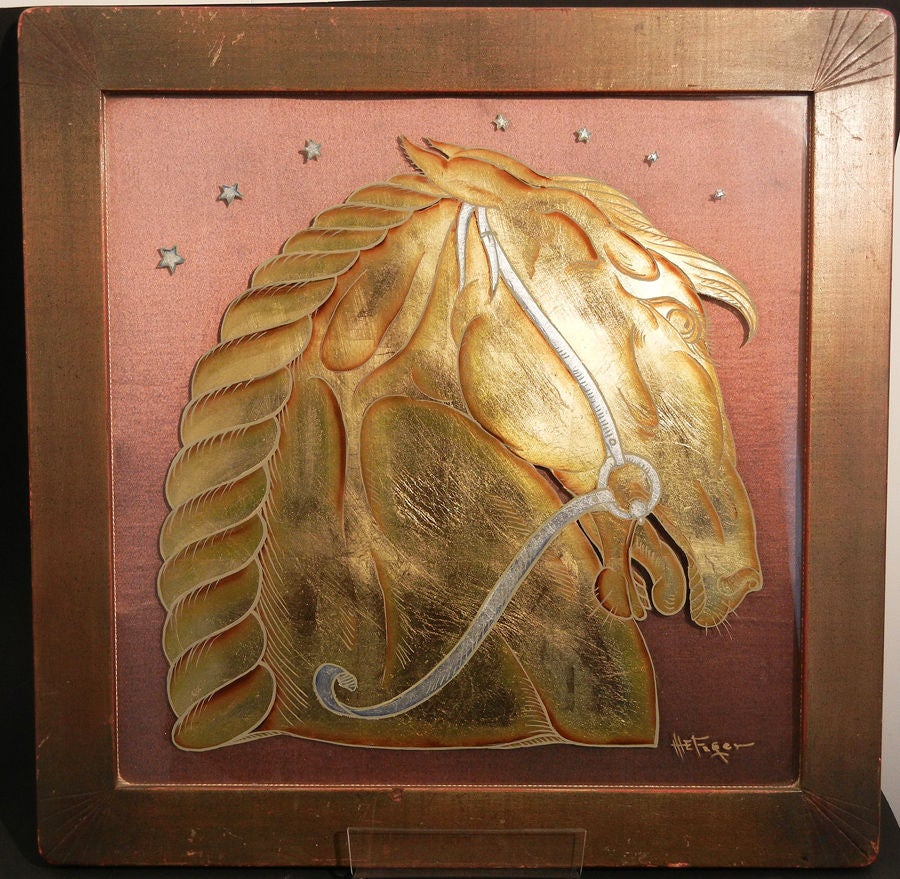 Brilliantly executed in gold leaf and paint, this stylized Art Deco panel depicting a horse's head (in gold) with bridle (in silver) was created by M. E. Fager, a Chicago artist. The glass panel is backed by its original deep-pink fabric and retains