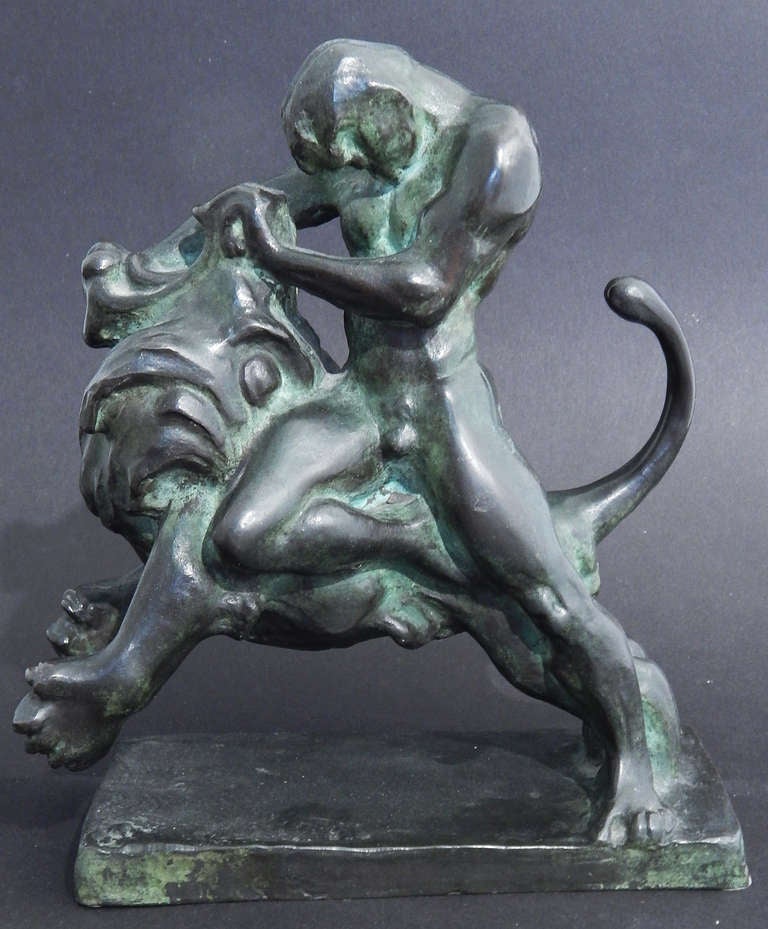 A superb example of Fritz Behn's mastery of scenes showing fierce struggles in the wild, this bronze depicts a strong male figure pulling open the jaw of a lion in his attempt to overcome his adversary.  The scene is full of energy and action, and