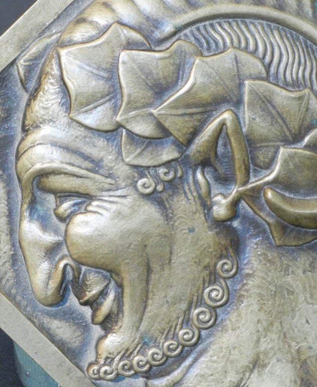 This rare, octagonal bronze plaque or paperweight depicts a grinning, mischievous satyr with a stylized beard indicative of its Art Deco manner. Sculpted by Pierre Turin, an important medalist and sculptor, this is the only example of this plaque we
