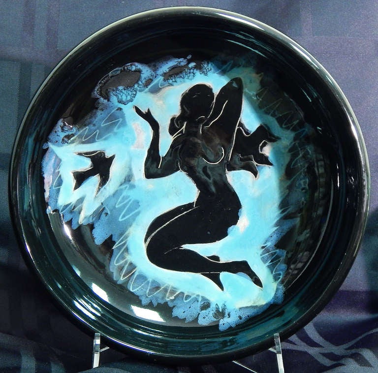 Beautifully composed and gorgeously glazed in jet black and sky blue tones, this rare serving bowl was created by one of the artists producing high quality ceramic ware in the pottery town of Vallauris, France after World War II, the same town where