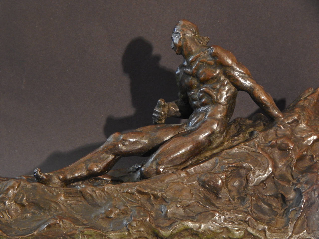 bird pulling man statue