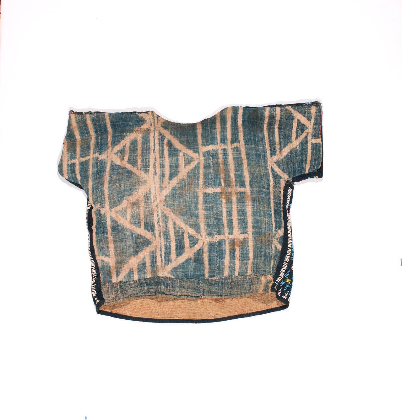 This is a rare ceremonial dance shirt from Cameroon. The beadwork is very special and the patterns full of movement. There is a small bronze bell attached to the front of the shirt. Pieces like this are now rare and hard to find.