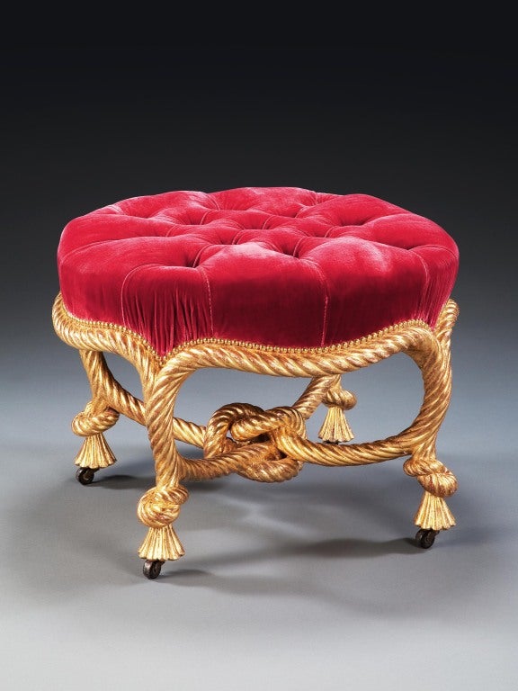 A Napoleon III finely-carved giltwood rope twist stool, in the form of entwined rope knotted at the base, now upholstered with deep-buttoned red silk velvet. In the manner of A.M.E. Fournier.

A.M.E Fournier was established by 1850 at 109