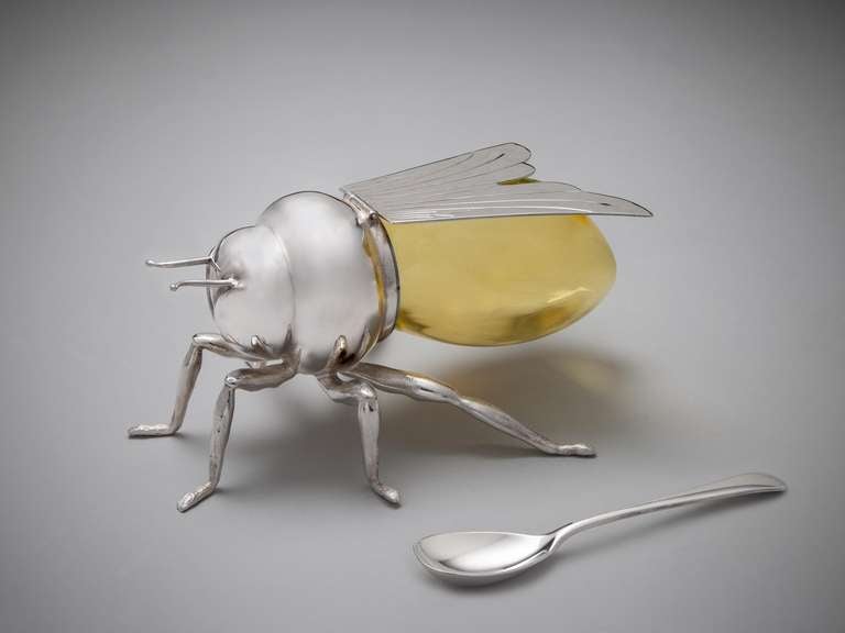 A highly unusual late 19th century honey pot in the form of a bee, the Sheffield plate head and legs supporting a honey coloured glass retainer for honey, the lid in the form of wings, the body and original spoon stamped Mappin & Webb.