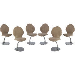 A Set of Six Charron Swivel Dining Chairs