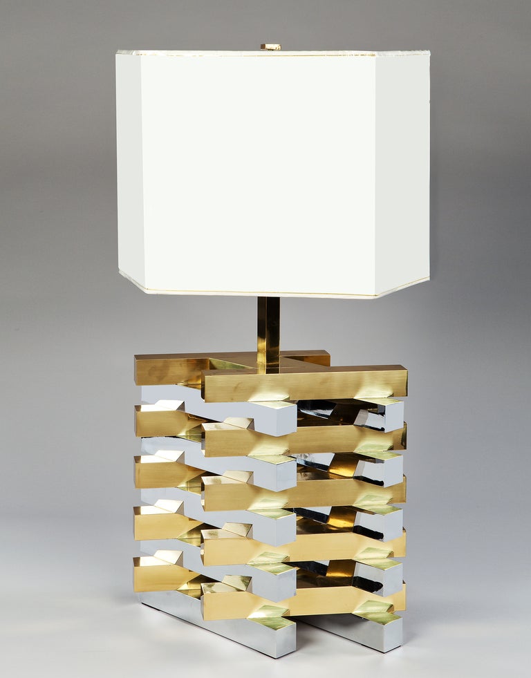  A brass and chrome table lamp constructed as a lattice of interlocking and contrasting rectangular blocks. The height of the base stands at 19 3/4in (50cm).