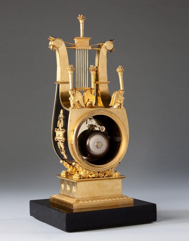 A Charles X Bronze And Ormolu Clock
