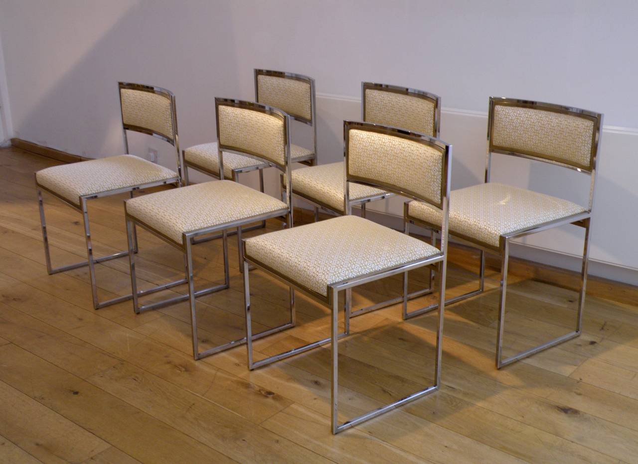 with chromed metal frame inset with brass edge
re-upholstered fabric