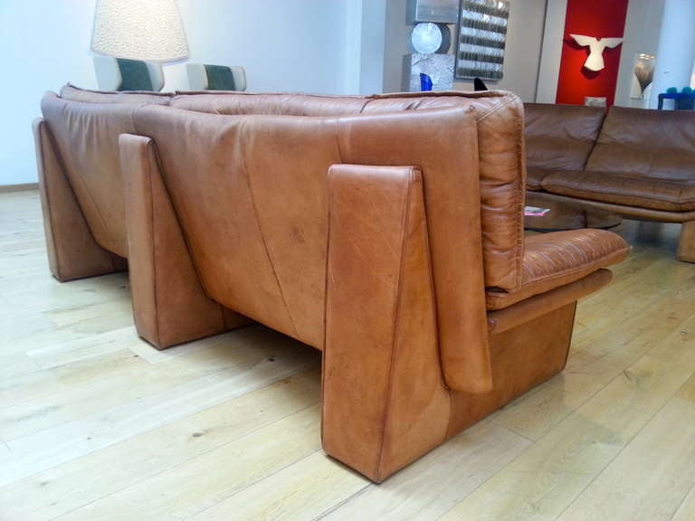 for Desede
Natural tan leather sofa on three supports, entirely clad in leather,
with original label with designer's logo