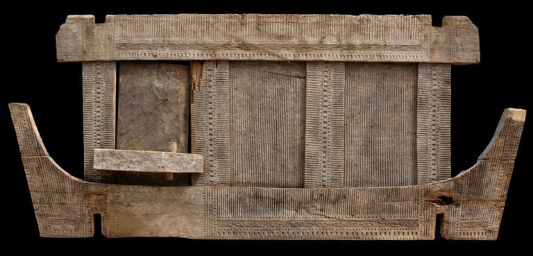 Large Saneh (architectural panel) from the exterior of a Torajan granary (Alang). Constructed of heavy wood planks, the surface carved in low relief with simple geometric patterns, the hinged door unadorned. Traditional Torajan homes and granaries