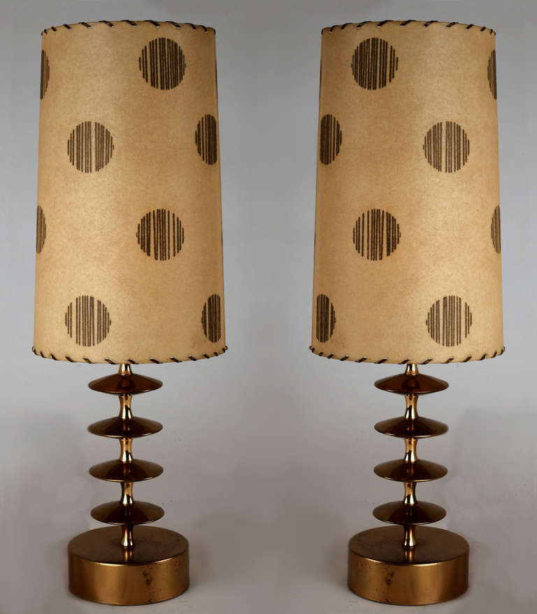 We haven't seen this lamp before - not as you see here, not as a floor lamp, nor as a larger table lamp.  We just had to have them.  These are precision-made machined brass beauties, each with a weighted base.  A stack of same-size, stylized &