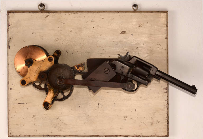 A Foote-Pierson & Co. brass winder device and a disassembled hand weapon are conjoined here to create a primitive door-mounted device with either sinister or protective uses in mind.   The home security device of the late 19th and into the early