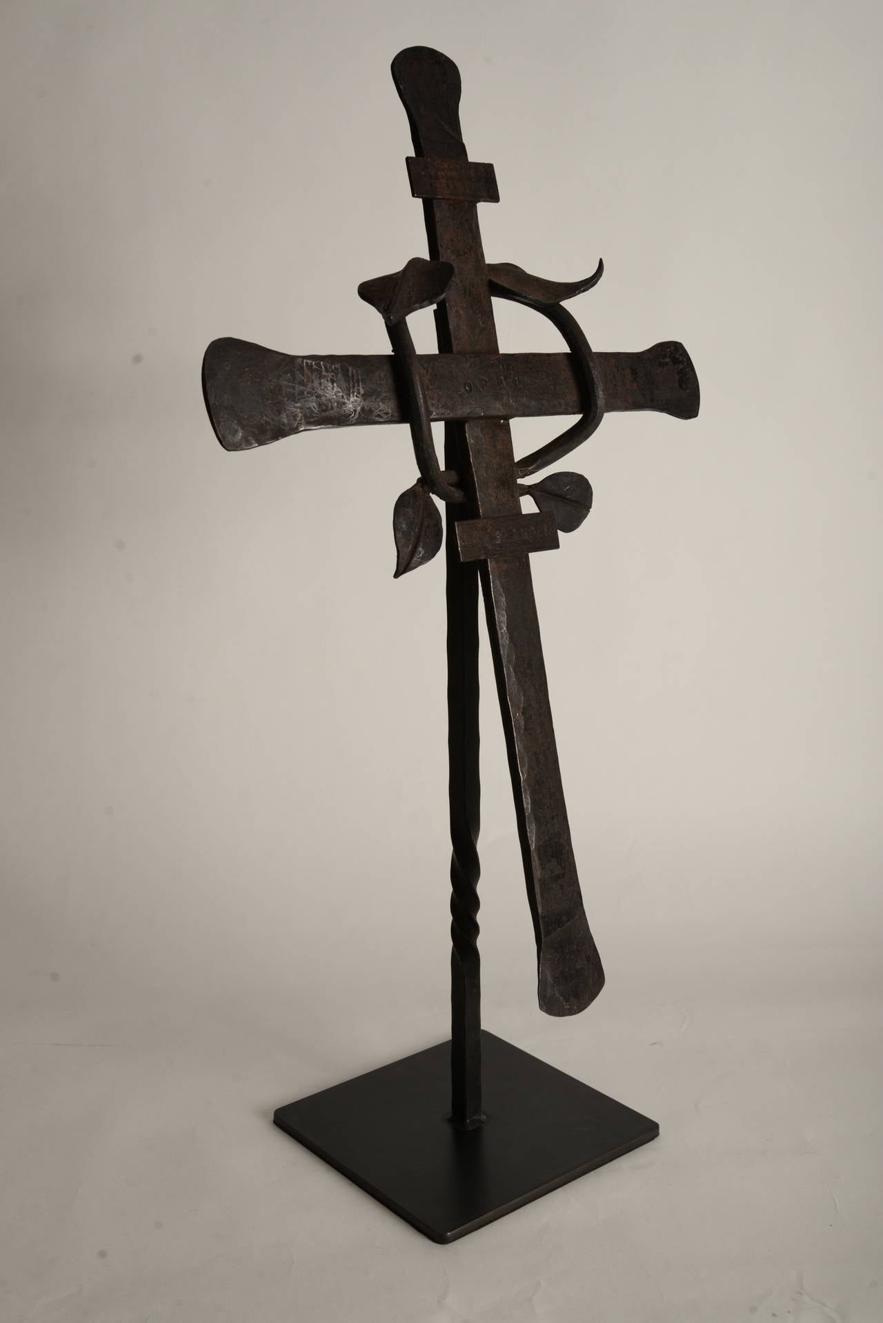 Hand-forged steel cross which appears to have been used as a dog memorial. The top plate reads 
