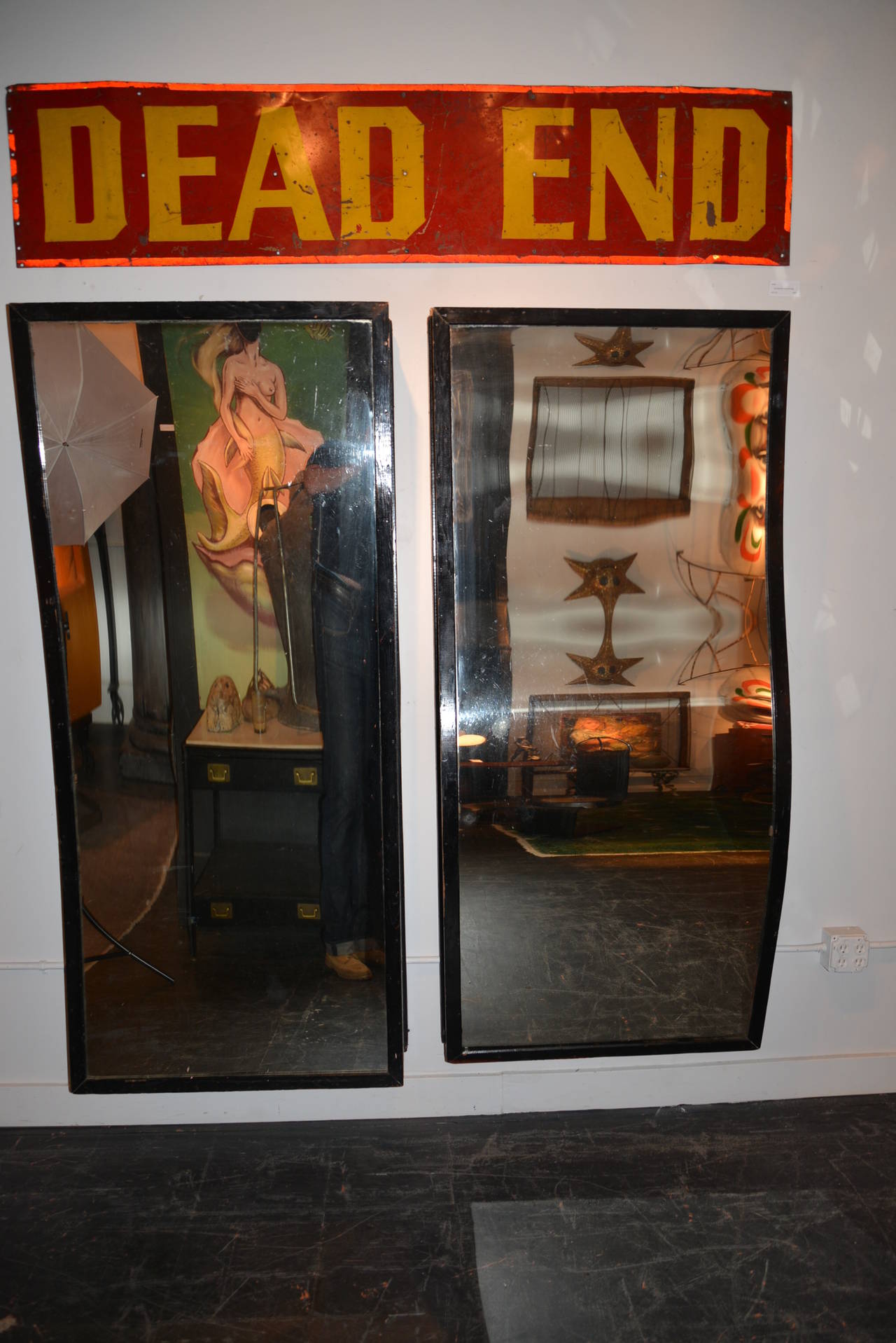 A pair of original 1920s convex and concave fun house mirrors. Both are trimmed in black painted douglas fir with custom-made French cleats for easy installation. These are very heavy and are the real deal.
