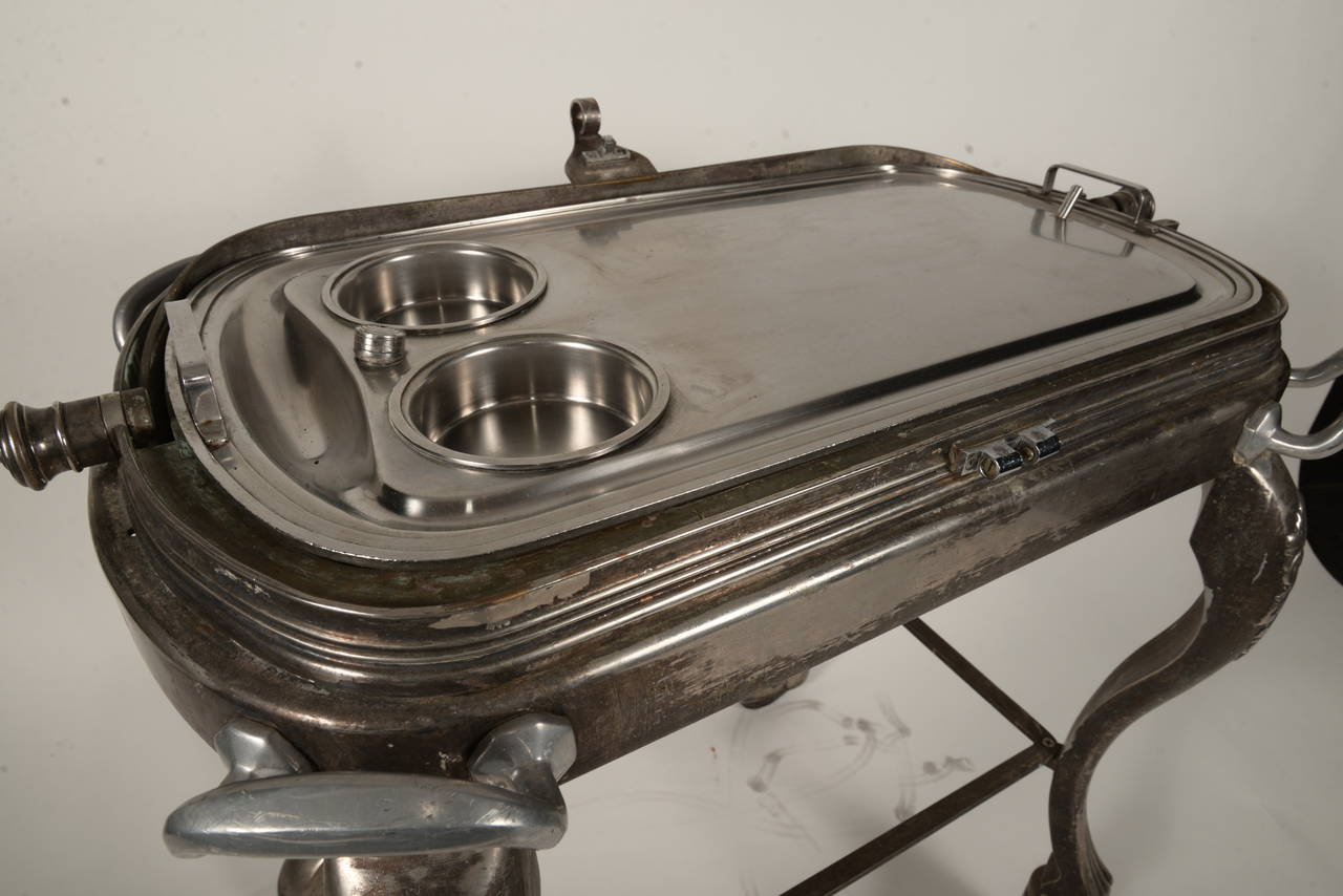 This elegant serving cart was used for table side service in a high end Dallas hotel back in the day. We think this would make a fabulous cocktail bar.