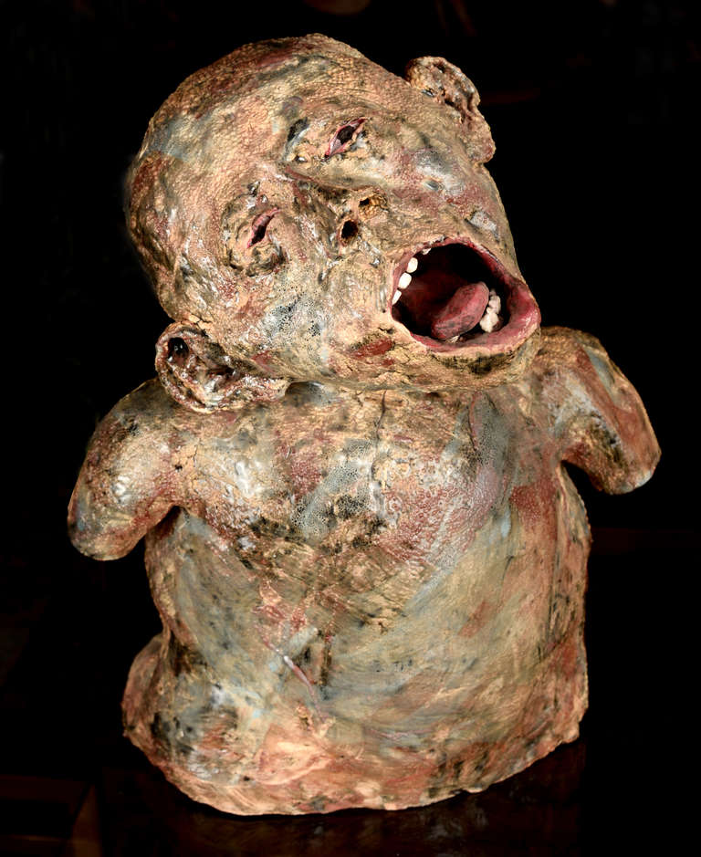 This writhing creaming figure may have been a student creation as it's unsigned. The contorted open mouth complete with teeth and tongue are very well done. One can almost feel his pain and anguish.