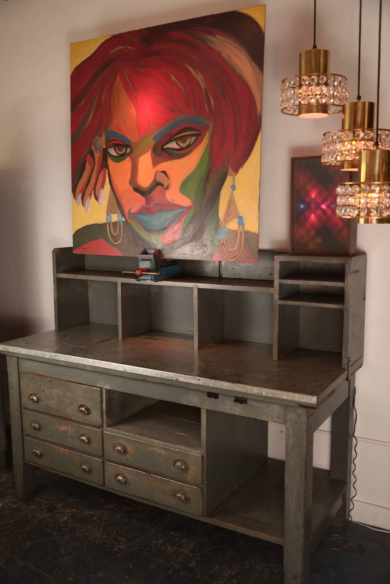 Large grey painted workstation with five drawers and a galvanized top.