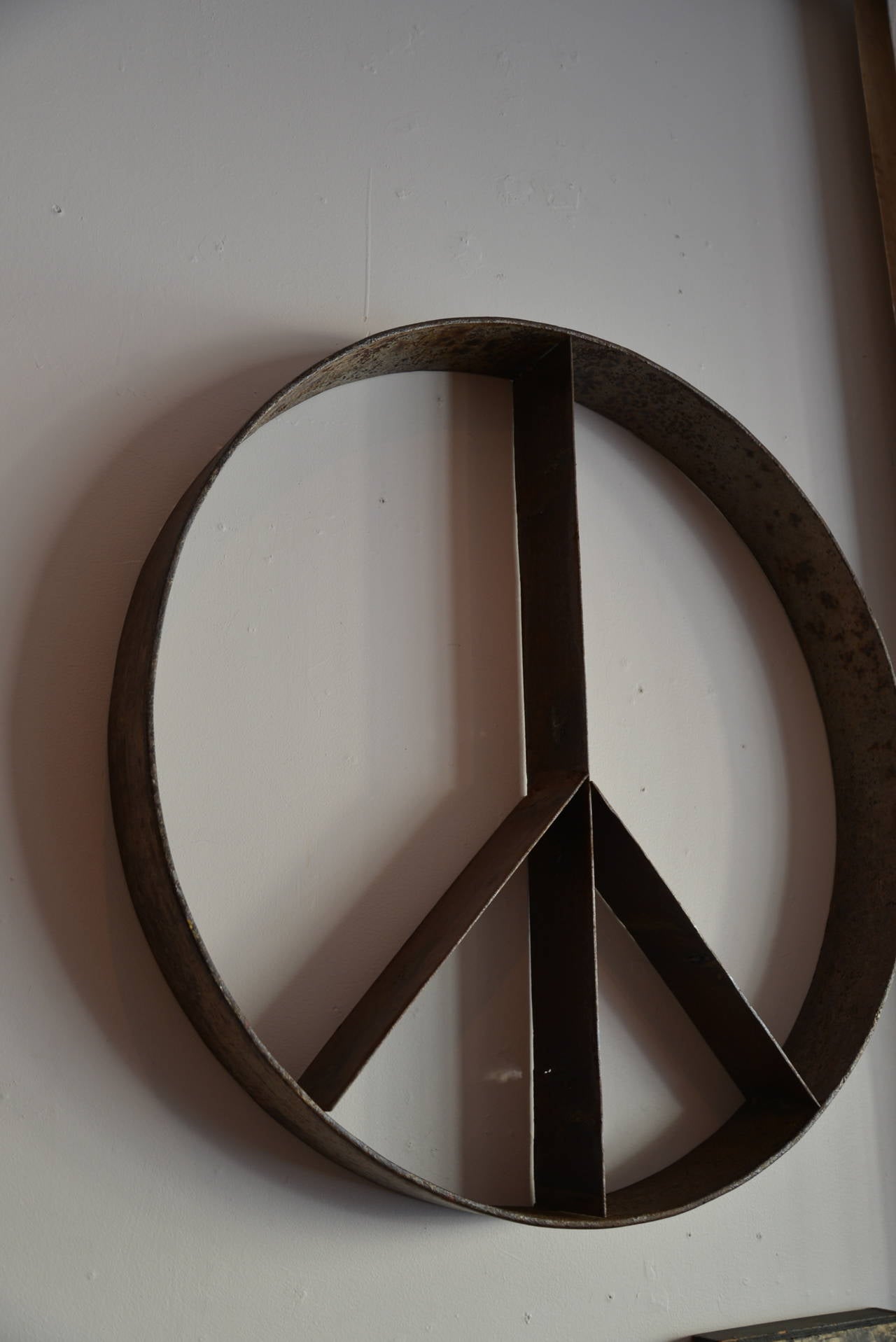 Folk art steel peace sign.
