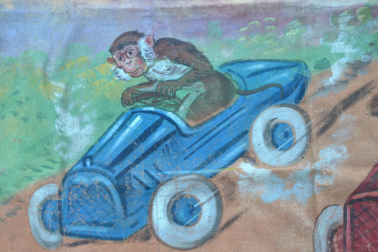 Hand-painted side show banner advertising monkey driven midget race cars.  This was an actual side show attraction back in the day.