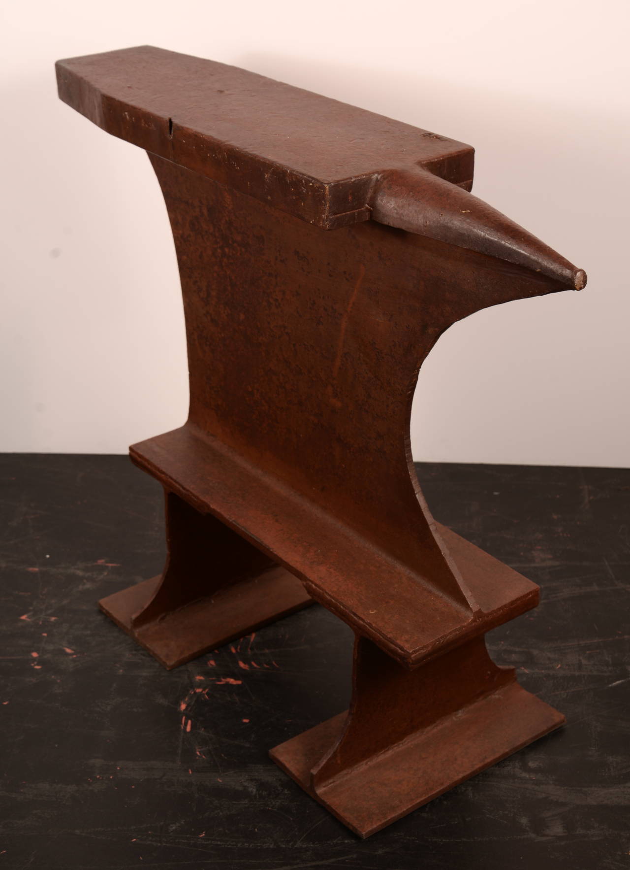 All steel vintage anvil to shape tin objects.  This happens to work wonderfully as a sculptural side table.