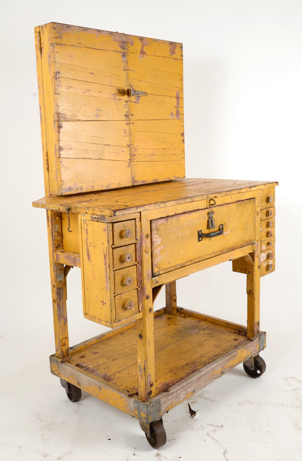 This was a one of a kind work station that came from the commercial division of John Deere and was probably made the man or woman worked on it. Complete with found object boxes as drawers and threat spools for knobs this piece celebrates dedication