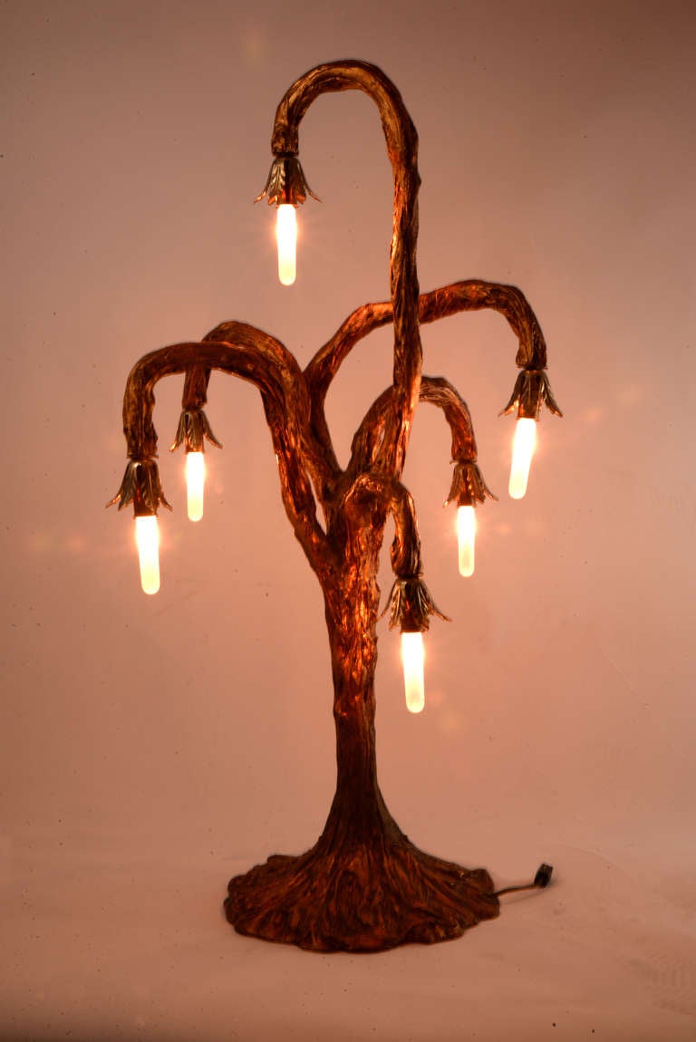 Gilded brass table lamp in an unusual stylized tree shape with five weeping branches, each with a chandelier-style socket.
