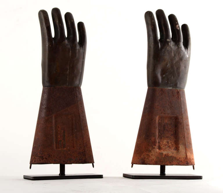Get a grip already!   This pair of  industrial glove-making molds with copper hands and steel gauntlets are set upon custom mounts of blackened steel.  Bold, sculptural, graphic appeal. Warm patina here as well.

Sold as a pair.