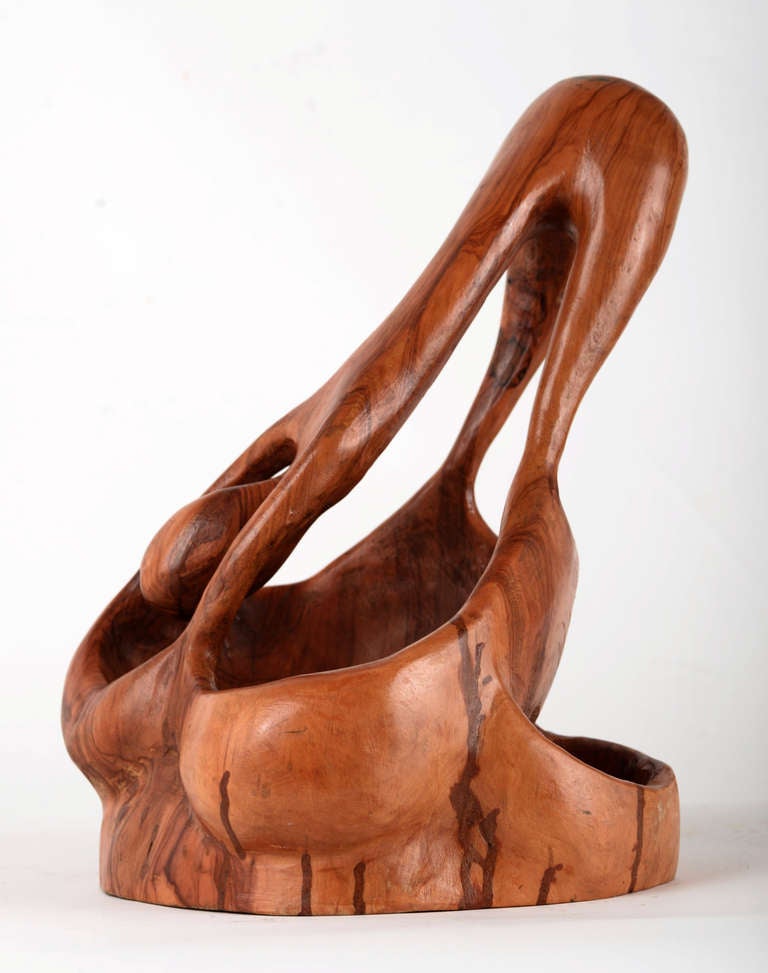 Carved and polished walnut burl bowl in an abstract humanoid form, posed expressively as if in a modern dance or yoga position.