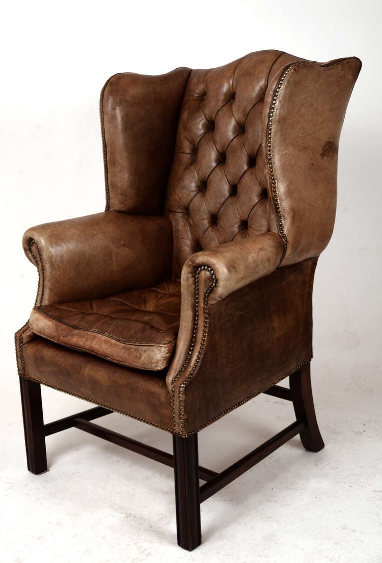 This pair of vintage wingbacks have everything:  tall and shapely form,  gorgeous caramel coloring, perfect diamond tufting and the well-worn patina everyone loves.  From the rolled arms, nailhead trim and curvaceous lines to the superior comfort,