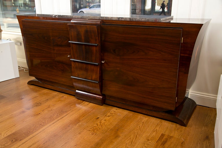 French art deco sculptured designed macassar ebony sideboard  with center drawers flanked by two doors adorned with ebonized trim  with interior in sycamore

 to view additional items from this dealer, click on their shop name to enter dealers