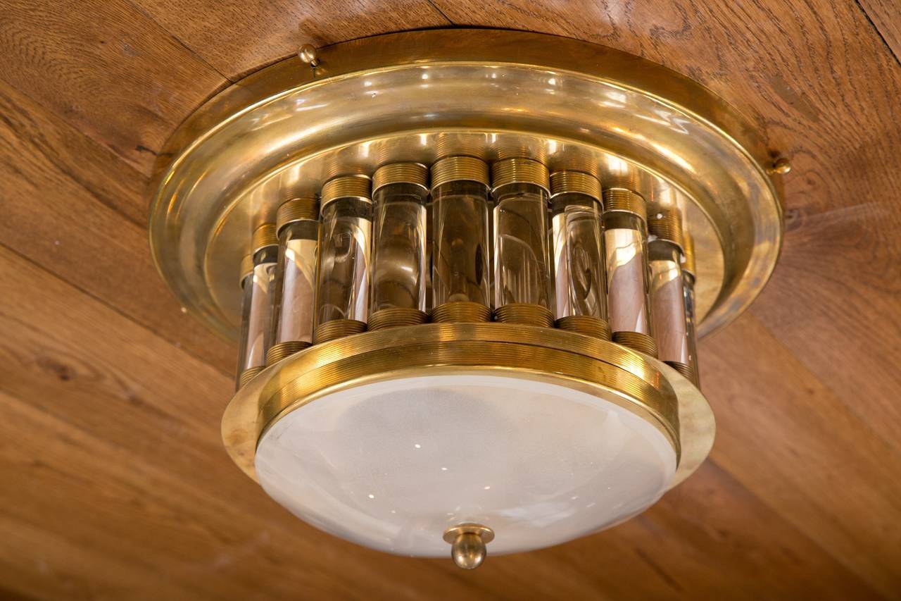 Elegant flush mount in blown glass and brass from Venini's 1940's  Hotel Collection.  This light is the smaller size available in the larger rod model.
Each light is stamped with Venini's mark.
none available in the shop at this moment, however,