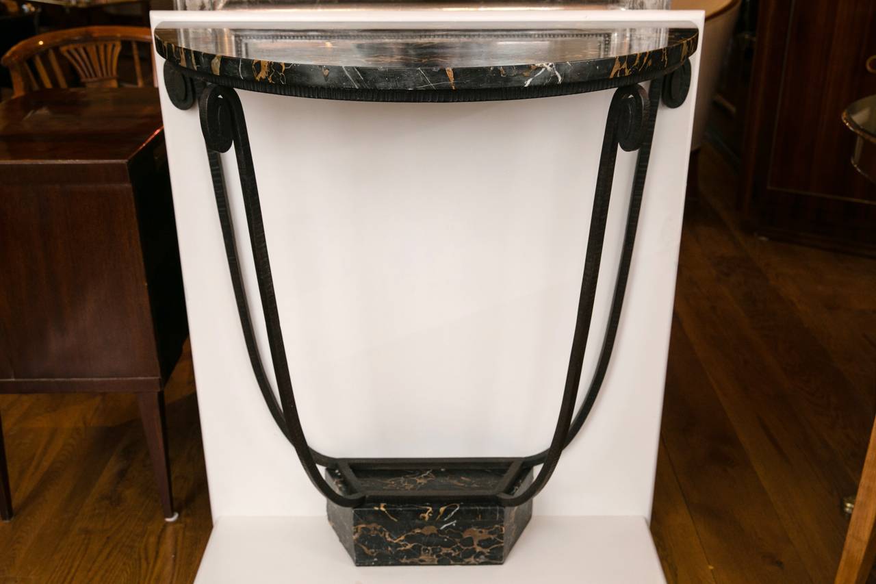 Graceful and minimalistic tulip shaped Art Deco console comprised of artistically hammered wrought iron and adorned with Italian black portoro marble , note quality of the wrought iron,
French, circa 1920.
attributed to Maison Les Riceys
(Mount