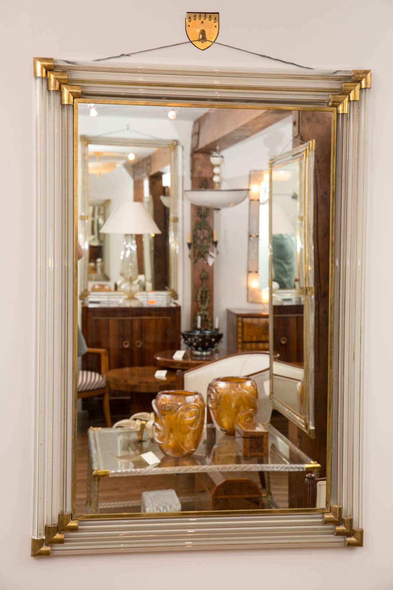 Three tiers of blown clear Murano glass rods with inlaid brass filet and brass fittings compose this mirror, Venice, Italy
Two available
Differing sizes can be ordered.