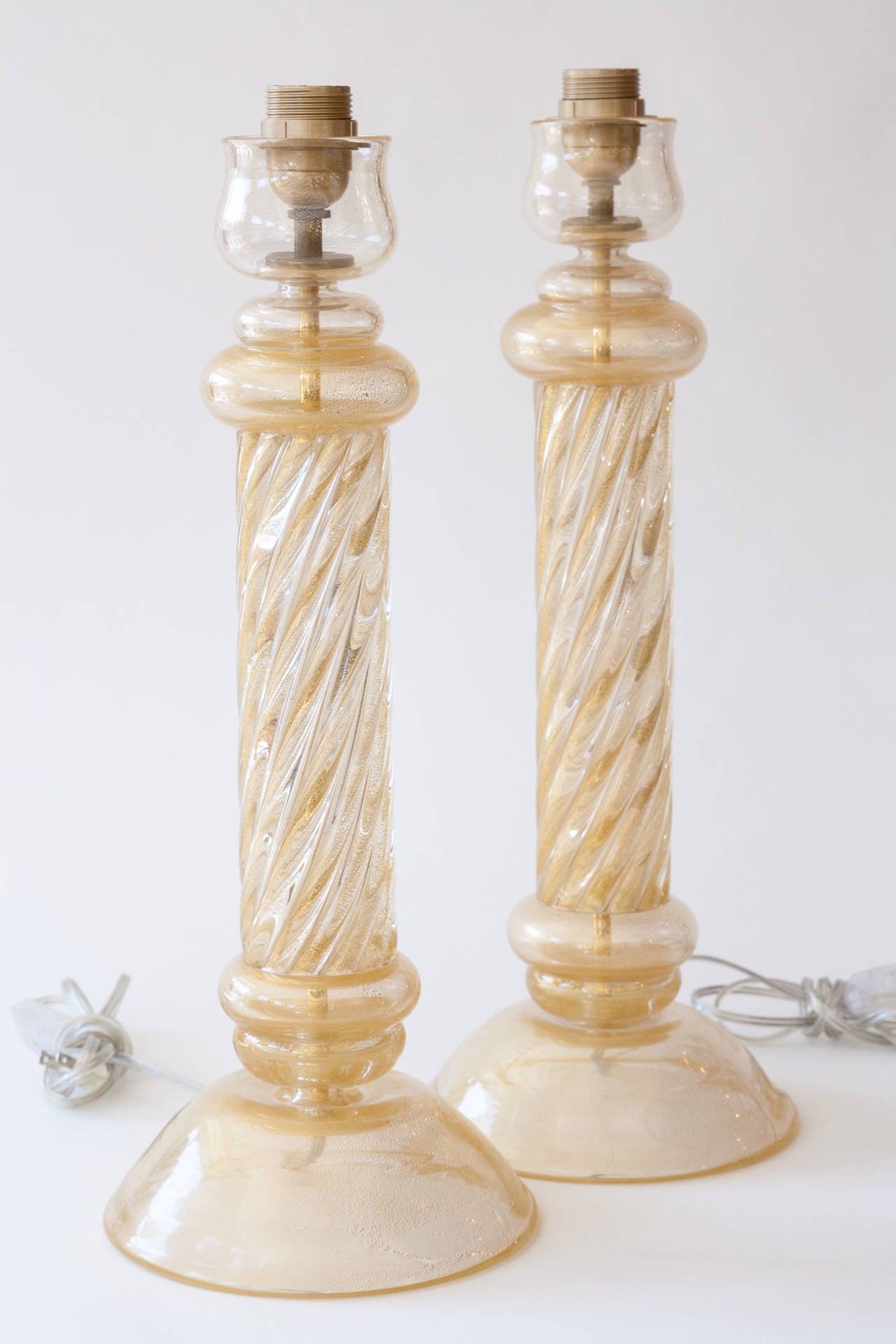 A very lovely pair of very slightly vintage blown gold lamps from the, circa 1980s,
note shorter length and they appear gold, the brass interior rod is not visible to the eye
also would be a fabulous pair of chunky candlesticks
to the top of