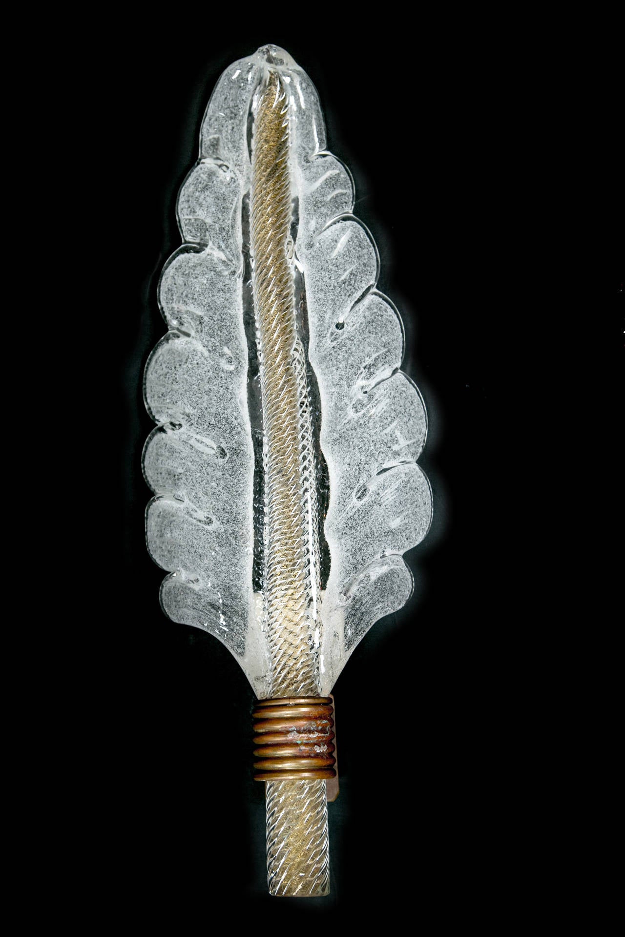 Wonderful shimmery and thickly blown leaf with twisting center, attributed to Barovier, Murano, circa 1950.
Electrified to code for one candelabra bulb up to 60 watts.

Just one wall light available!