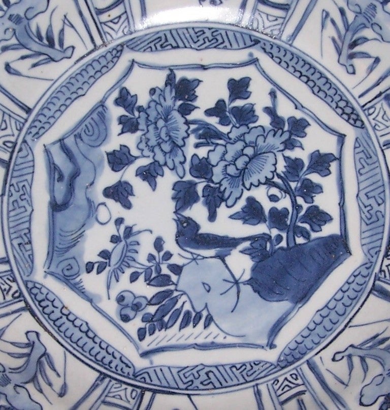 Provenance: The Hatcher Collection A dish with scalloped border and-bird-on-rock motif from the Hatcher Collection, c1630-45, Jingdezhen, China with flowers in the large panels painted on the flat rim and unmolded cavetto.
A single bird near a