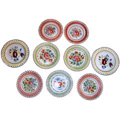 A Group of 9 Arcaded Creamware Plates in Bright Colors
