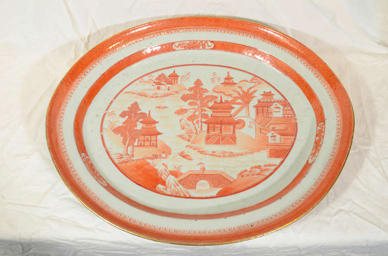 A large 19th century Chinese orange Canton oval platter with provenance from The Collection of The Springfield Museums Springfield, Massachusetts.
The porcelain was glazed and fired at Jingdezhen, China then decorated with enamels at Canton