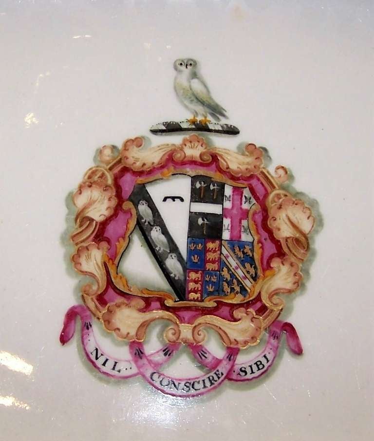 A pair of Coalport platters with elaborate coat of arms with an owl on the crest and the motto 