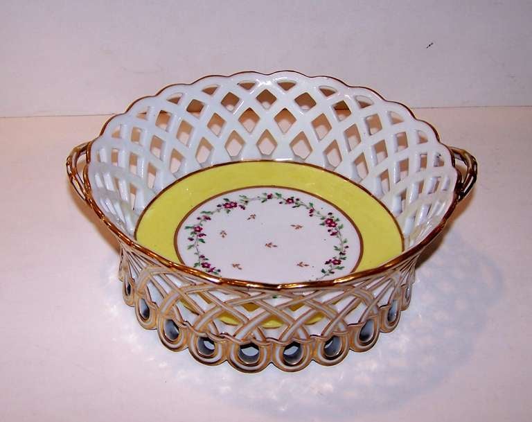 A French, 18th century, pierced porcelain basket made by the Clingnancourt factory. It is beautifully gilded on the outside. On the inside a wide yellow border surrounds a delicate band of violets.
Clignancourt, also known as 