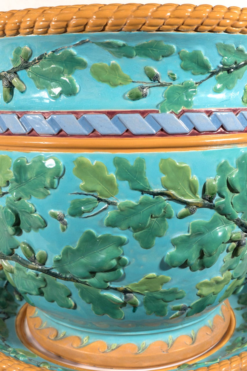 A large 19th century Minton Majolica jardiniere decorated to the exterior with green oak leaves and acorns on a turquoise ground.The design and the colors blend beautifully.  Handles in the form of oak branches complete the design. The inside of the