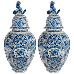 A Large Pair of Dutch Delft Blue and White Covered Vases