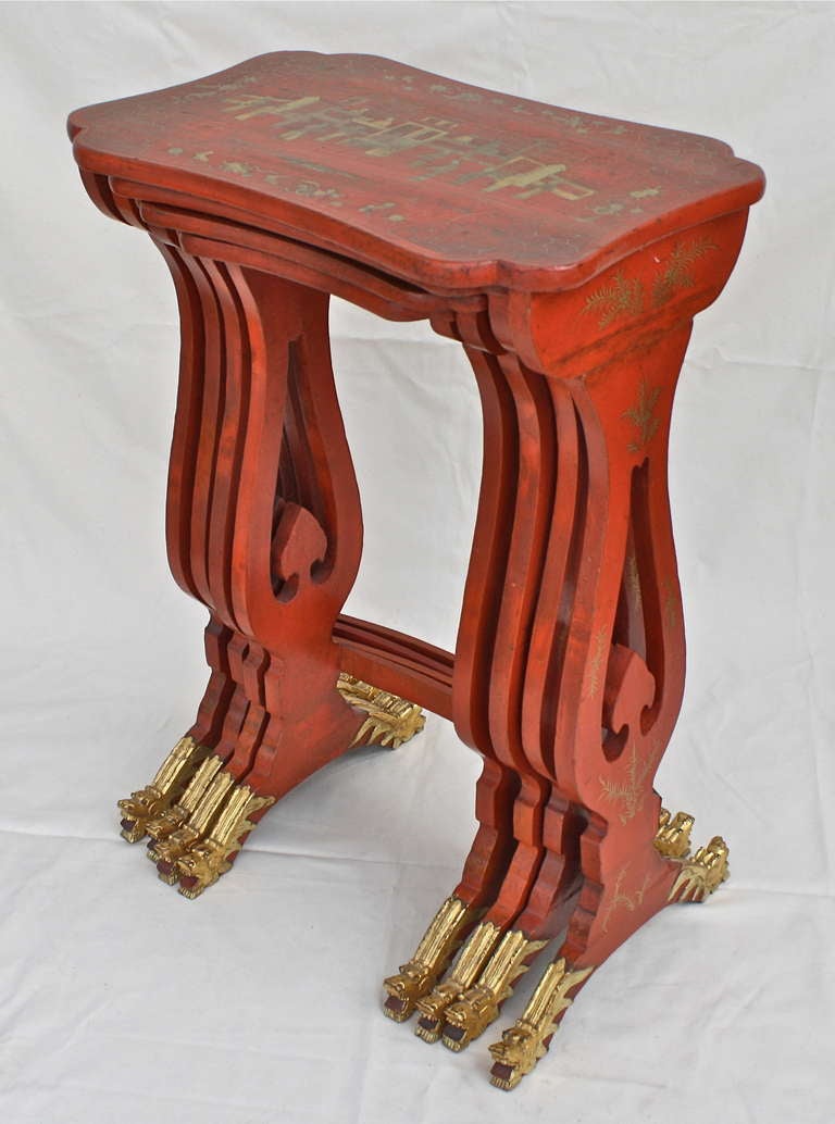 In rare persimmon lacquer with outstanding carved and gilded dragon feet.  Meticulously detailed parcel-gilt palace scenes; with up to sixteen courtiers and architectural follies. The table tops are not just simply rectangular.  Superb Chinese