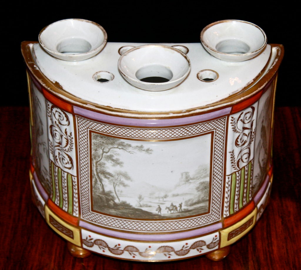 A porcelain demilune 'bough' pot intended for display of crocus or hyacinth bulbs; in two parts with removable lid. Very fine landscape central panel, and two side panels of peacocks in trees. Exceptional design and coloration per Chamberlain's of