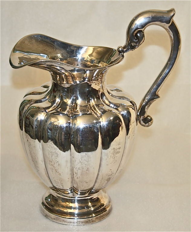 An early pre-World War II sterling silver water pitcher, marked L. Maciel,  Made in Mexico;  Sterling 0.925 <br />
Highly skilled script monogram:  E. V. J. ( J centered).  Provenance:  an American ex-patriate living in Lomas de Chapultepec.