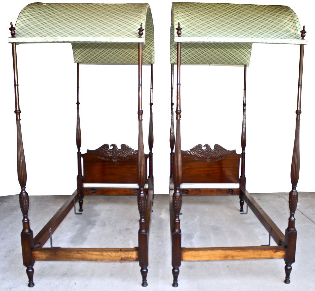 PAIR of American Eagle hand carved Sheraton manner mahogany four-poster canopied beds: outstanding EAGLE, SHELL AND SEAWEED carved headboards, reeded and ring turned posts, acanthus leaf carving to foot post balusters, on turned feet; with all eight