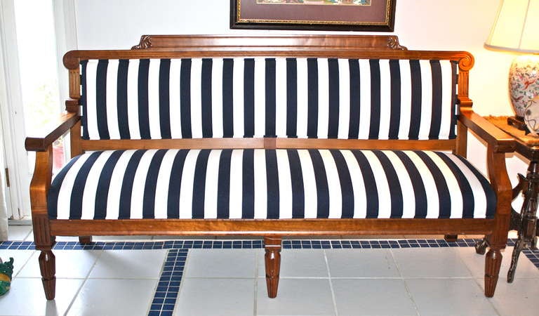 Deaccessioned from a Masonic Temple, a massive American Arts & Crafts movement settee or long hall bench.  Stylistically, through comparison to other known early samples, it appears to have been made by a Woodstock area craftsman predating the