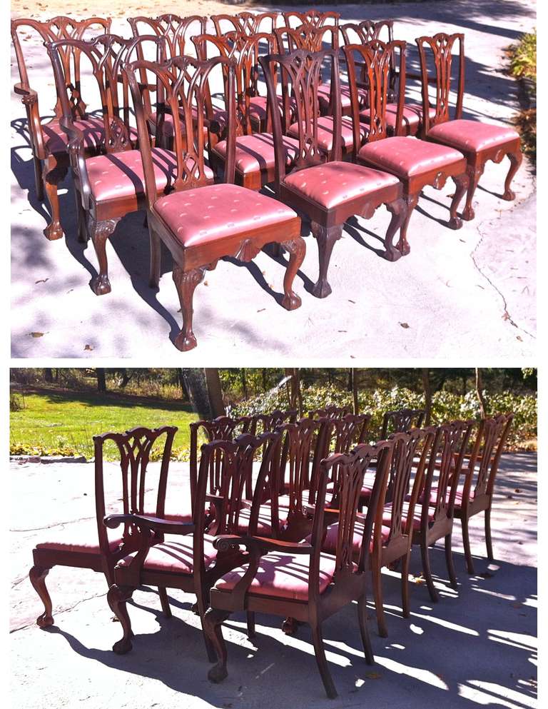 An unusual and eccentric assembled COLLECTOR'S set of twelve Philadelphia Chippendale Revival mahogany dining chairs.  There are FOUR ARMCHAIRS or 'carvers':  for host and hostess at each table end, and for two guests of honor.  The two additional