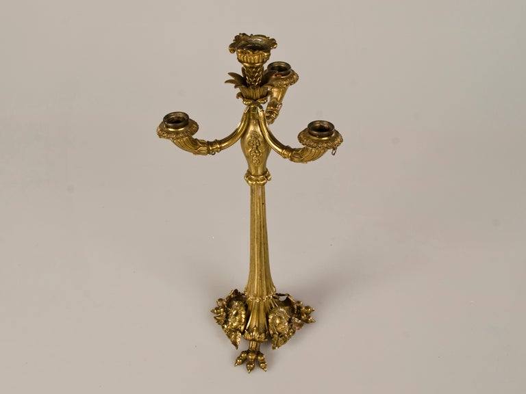 A fabulous Art Nouveau gilt bronze candlestick from France c.1890. The beautiful lines of this candlestick have a sensuous quality to them that was quite appealing at the end of the nineteenth century in architecture and interior design as the forms