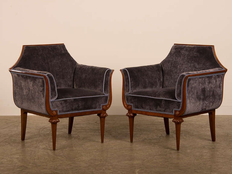 Pair of Neoclassical mahogany bergeres, Italy c.1900. These comfortable armchairs feature a unique line and profile designed to be seen from the front, back and sides with equal visual impact. The chairs themselves are modelled after the famous